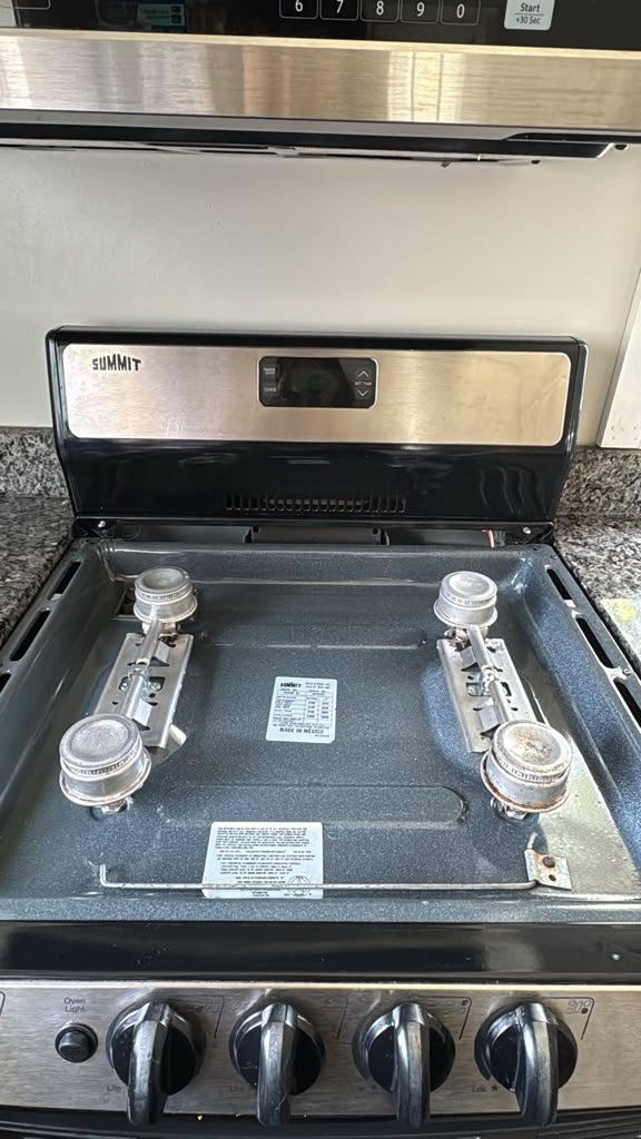 Heavily soiled stove top before deep cleaning